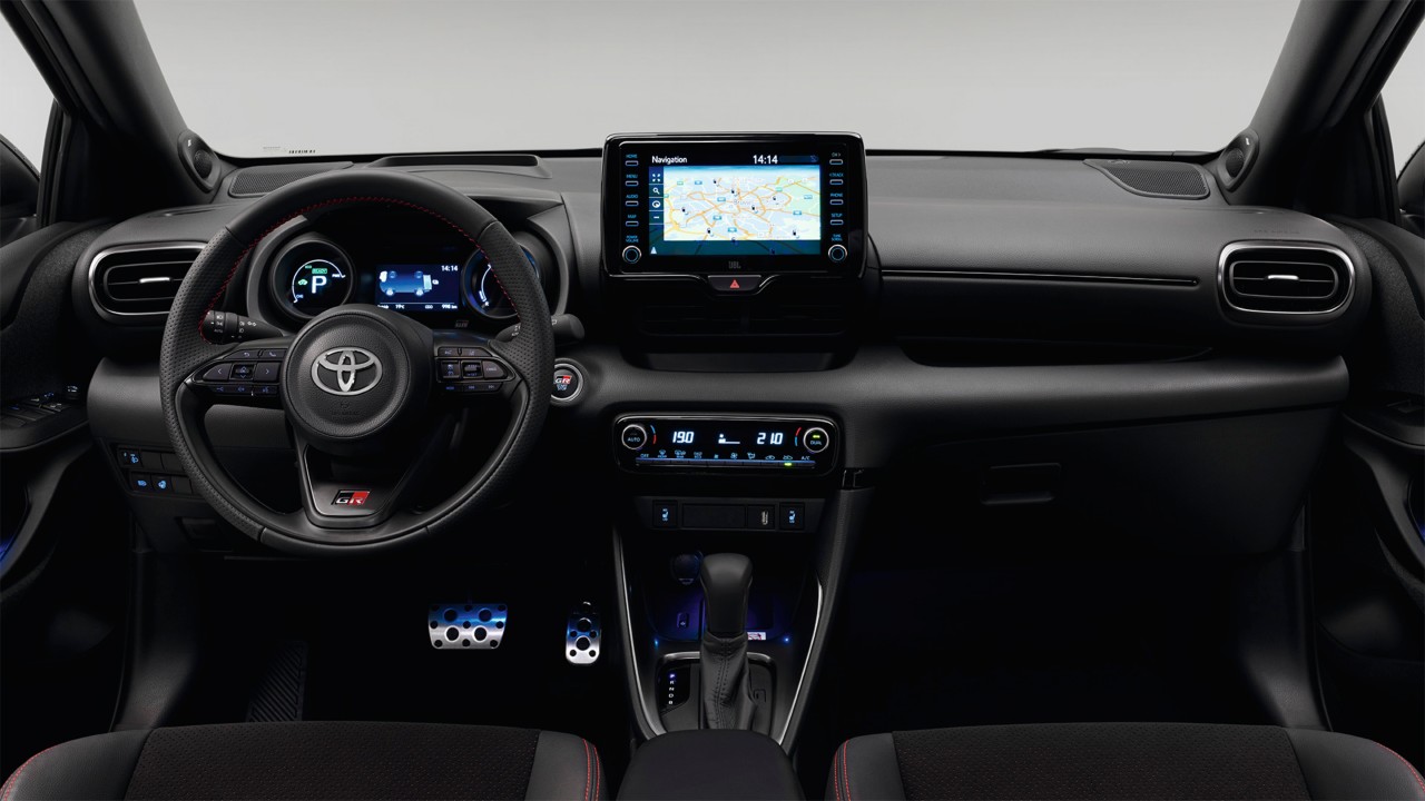 Model shown is Yaris GR SPORT  in bi-tone Dynamic Grey Night Sky Black roof (2RZ) and GR SPORT black fabric with red stitching seat